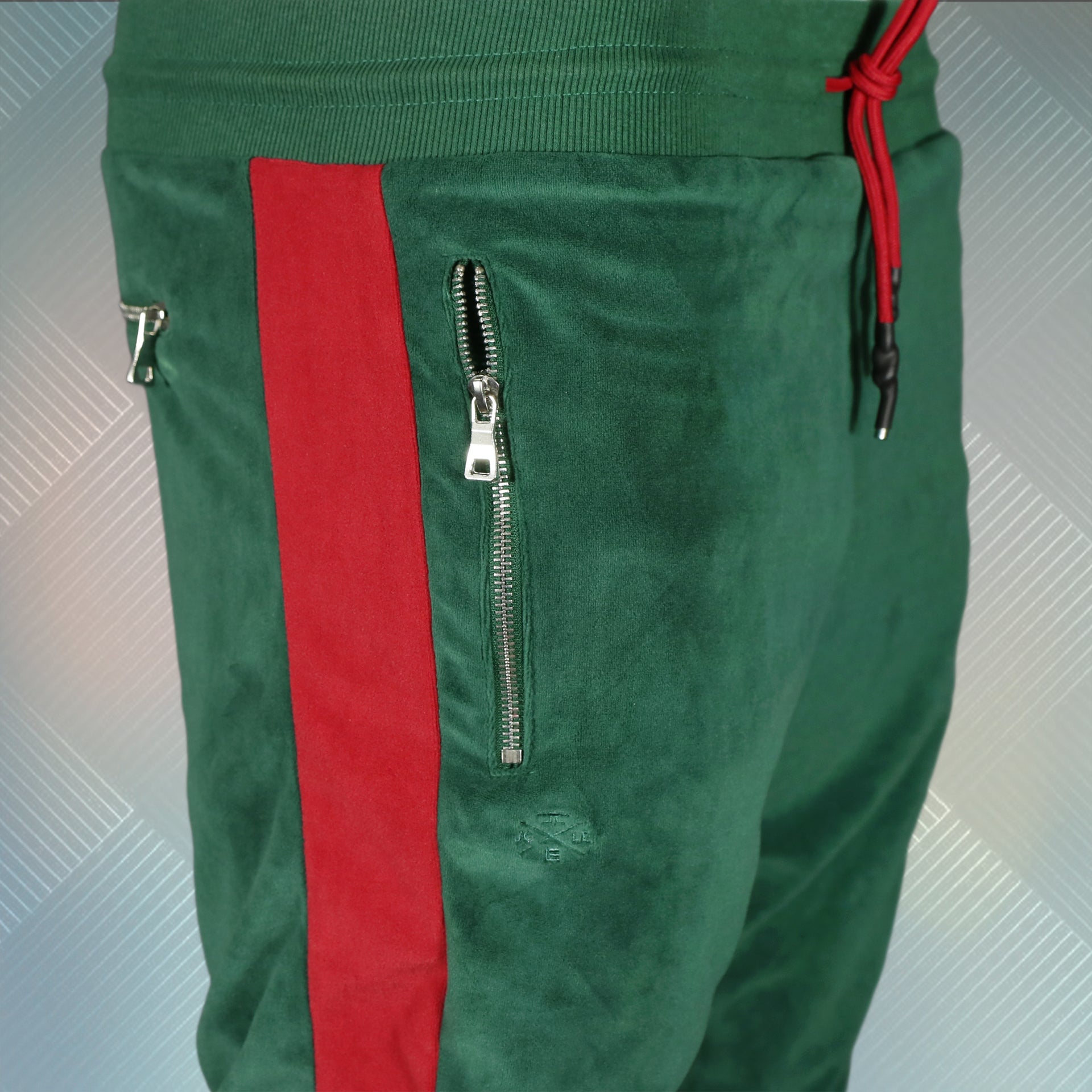 wearers right of the Italian Colorway Inspired Italian Fashion Green Red Stripe Snake and Bees Velour Track Pants
