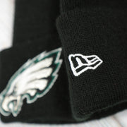 new era logo on the Philadelphia Eagles Super Bowl LII Patch Pom Pom Beanie | Midnight Green, Black, And White Striped Beanie