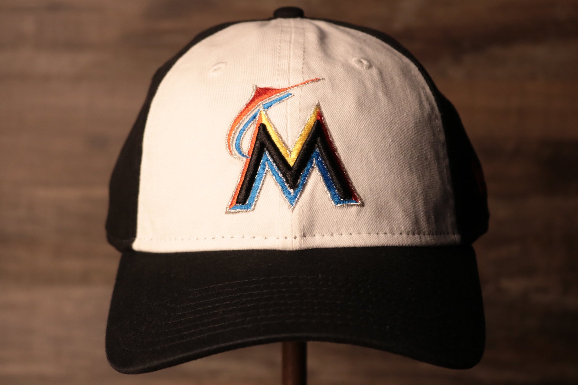 Marlins Dad Hat | Miami Marlins Retro Baseball Cap the front of this cap is white with the marlins logo on it