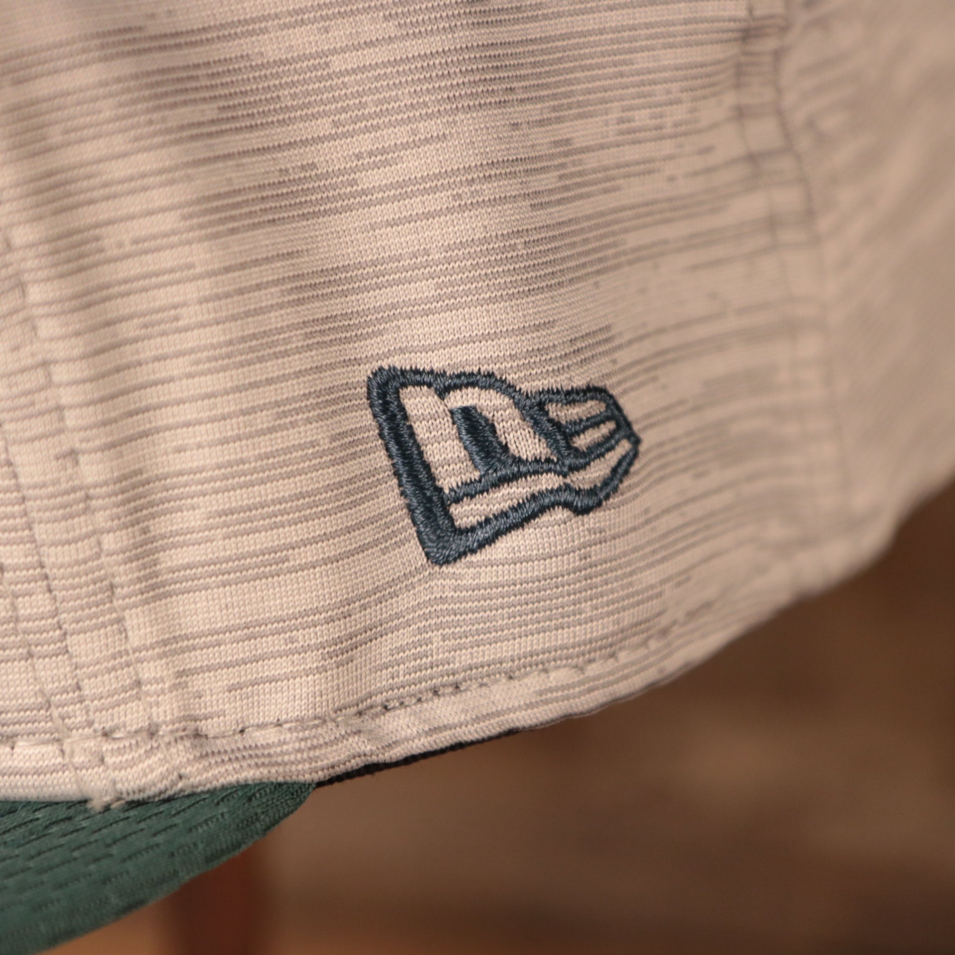 A closeup shot of the New Era patch on the side of the 2021 nfl on field snapback hat.