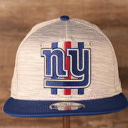 The Giants patch on the front side of the New Era training 2021 gray snapback hat.