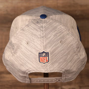 The NFL logo on the back of gray New Era nfl on field training snapback hat.