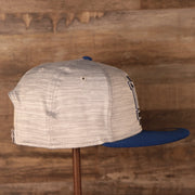 A sideview shot of the snapback hat of the new era training 2021 gray.