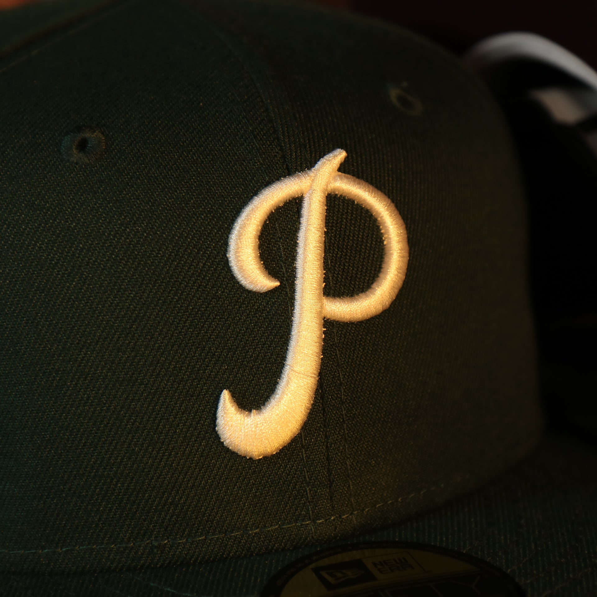 Close up of the Phillies logo on the Philadelphia Phillies Cooperstown 1952 All Star Game Side Patch Maroon UV 59Fifty Fitted Cap | Vintage Christmas Movie Pack