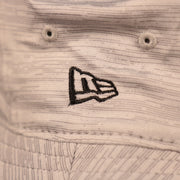 A closeup shot of the New Era patch on the side of the gray 2021 nfl training atlanta falcons bucket hat by New Era.