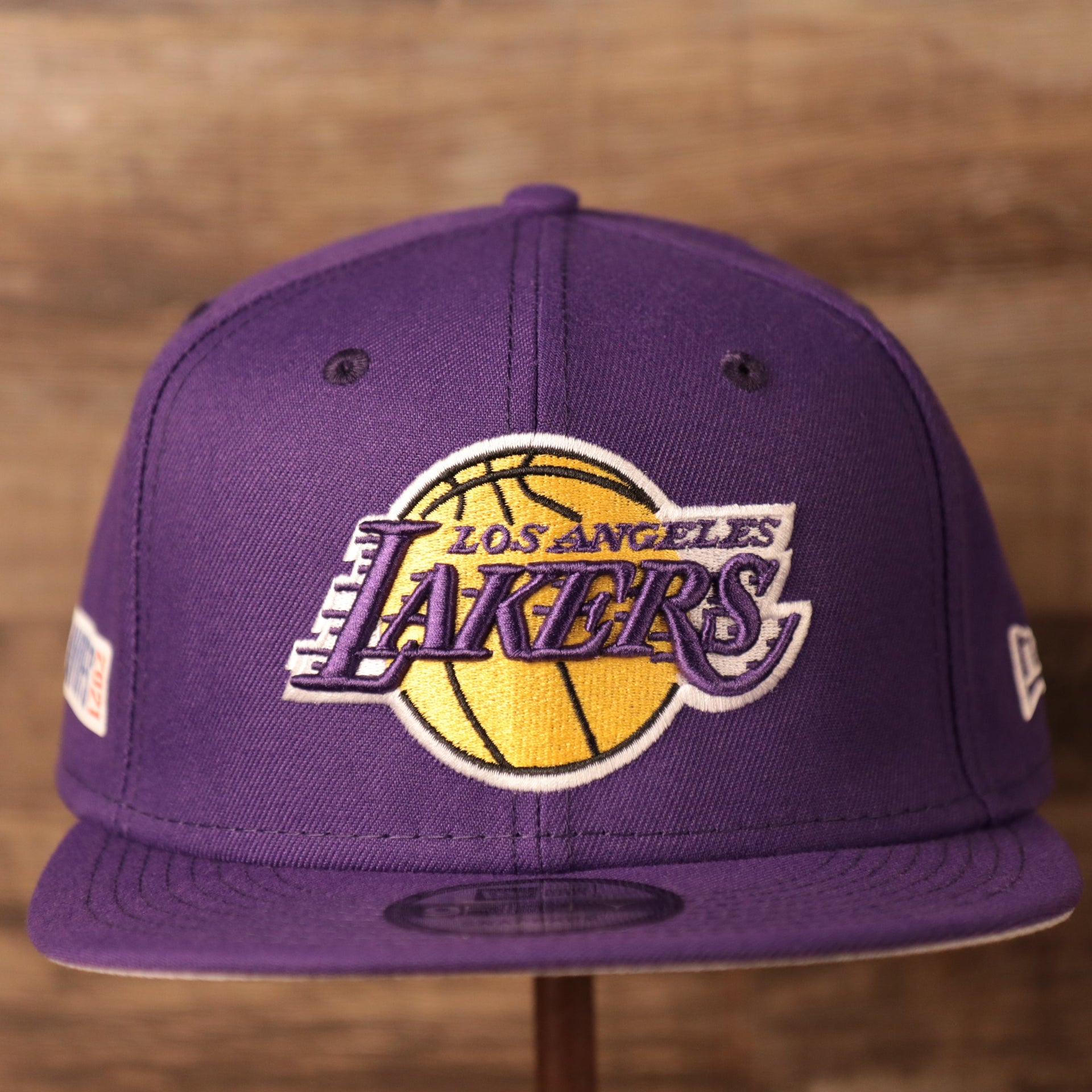front of the Los Angeles Lakers 2021 NBA Playoff Side Patch Purple 9Fifty Gray Bottom Snapback Hat