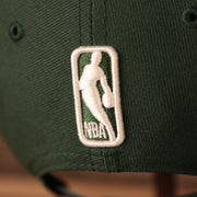 nba logo on the Milwaukee Bucks 2021 NBA Playoffs 9Fifty Gray Bottom Side Patch Snapback Hat