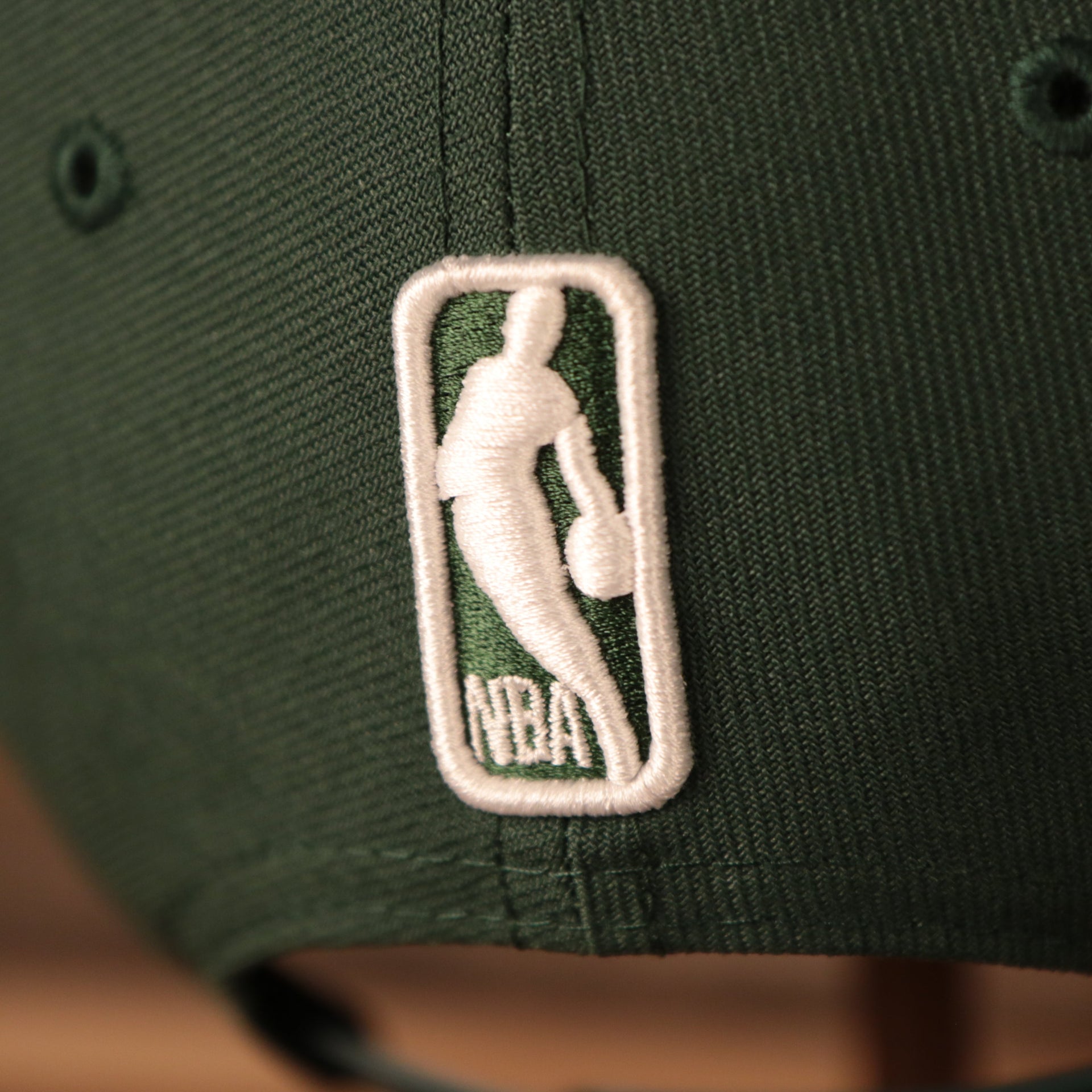 nba logo on the Milwaukee Bucks 2021 NBA Playoffs 9Fifty Gray Bottom Side Patch Snapback Hat