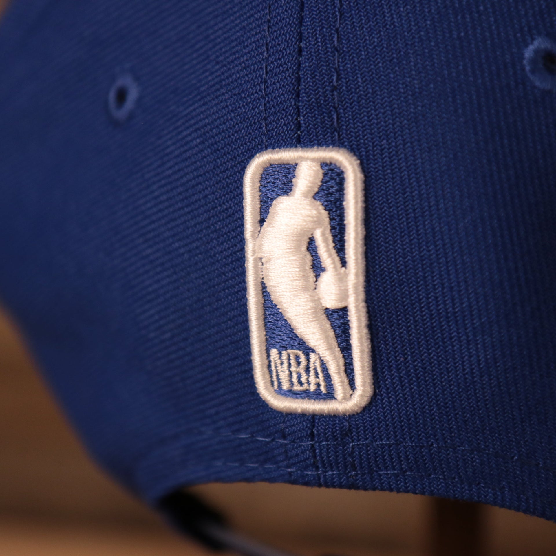 nba logo on the back of the Philadelphia 76ers 2021 NBA Playoffs Royal Blue 9Fifty Gray Bottom Snapback Hat