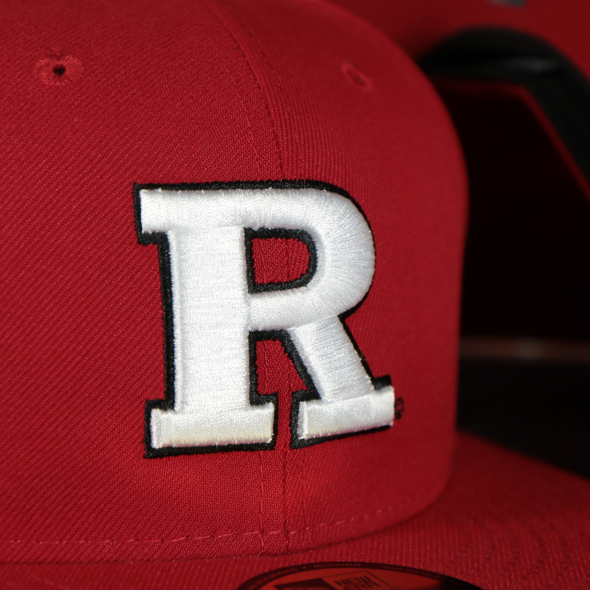 rutgers logo on the front of the Rutgers Scarlet Knights Red Underbrim 59Fifty Fitted Cap | Red Fitted Cap