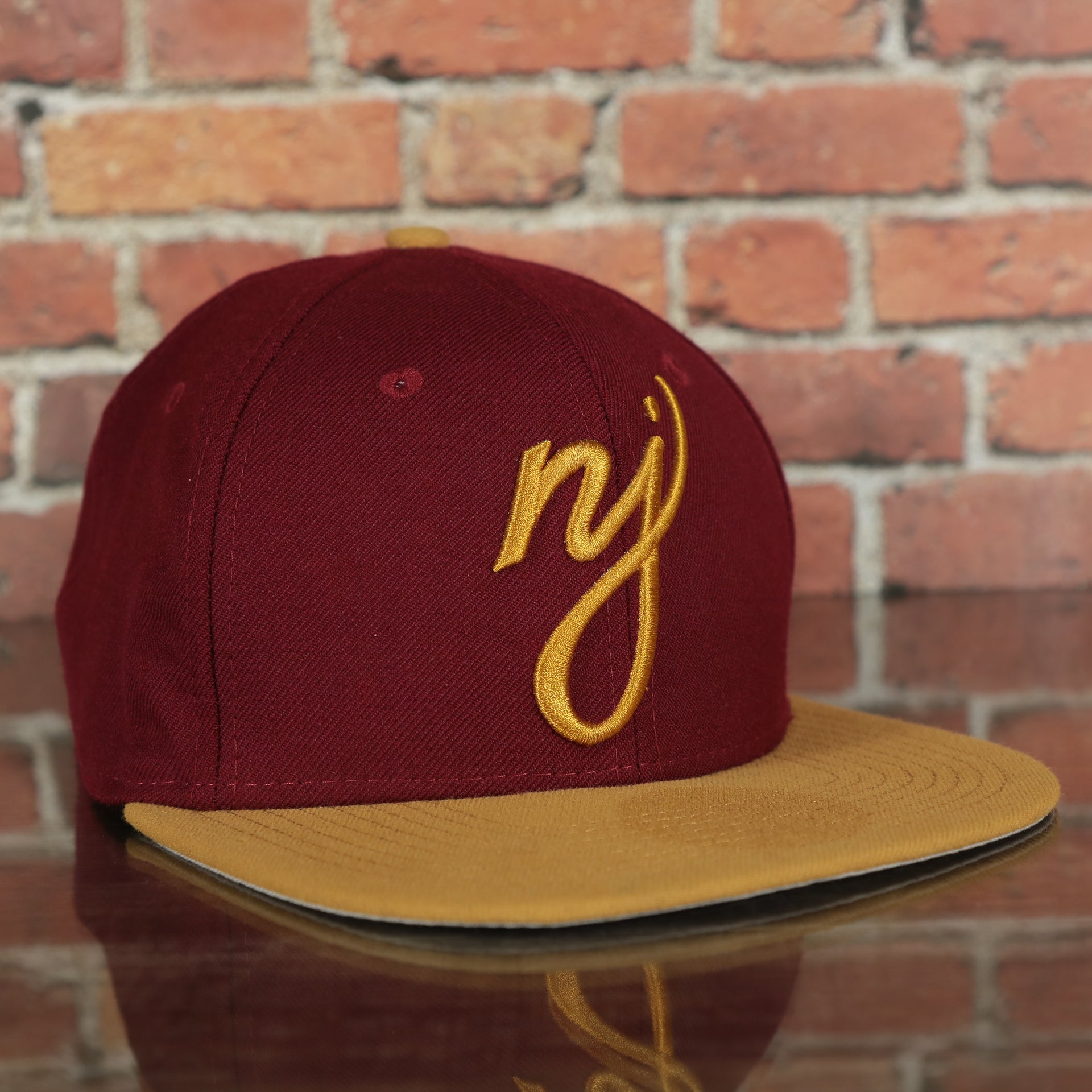 front of the New Jersey "NJ" Hat | New Jersey Garden State 9Fifty Gray Bottom Snapback Hat | Maroon / Gold *DISCOLORED