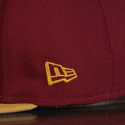 new era log on the side of the New Jersey "NJ" Hat | New Jersey Garden State 9Fifty Gray Bottom Snapback Hat | Maroon / Gold *DISCOLORED