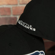 Seattle Seahawks wordmark logo on the back side of the Seattle Seahawks Black Underbrim 59Fifty Fitted Cap | Black Fitted Cap