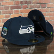 front and bottom of the Seattle Seahawks Seattle Skyline Side patch Navy Blue Underbrim 59Fifty Fitted Cap | Navy Blue Fitted Cap