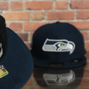 underside and front of the Seattle Seahawks Seattle Skyline Side patch Navy Blue Underbrim 59Fifty Fitted Cap | Navy Blue Fitted Cap