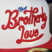 city of brotherly love script logo on the Philadelphia 76ers 2022 City Edition City Of Brotherly Love Blue Bottom 59Fifty Side Patch Fitted Cap | New Era, White