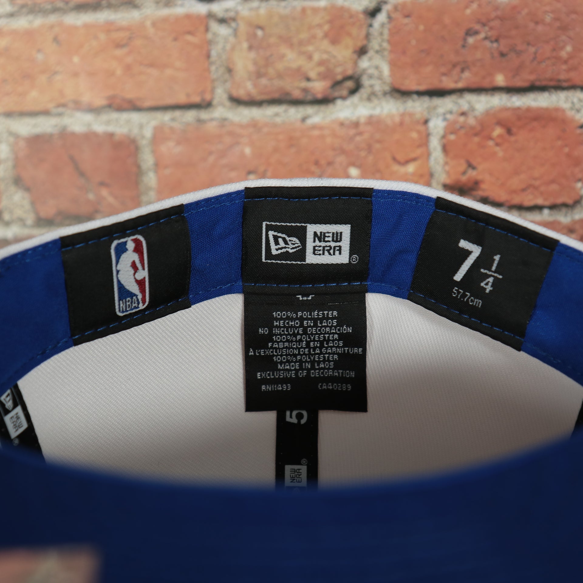 new era tag on the inside of the Philadelphia 76ers 2022 City Edition City Of Brotherly Love Blue Bottom 59Fifty Side Patch Fitted Cap | New Era, White