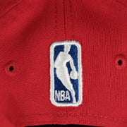 nba logo on the backside of the Philadelphia 76ers 2022 City Edition Vintage 76 Logo Gray Bottom Youth 9Fifty Side Patch Snapback Cap | New Era, Red