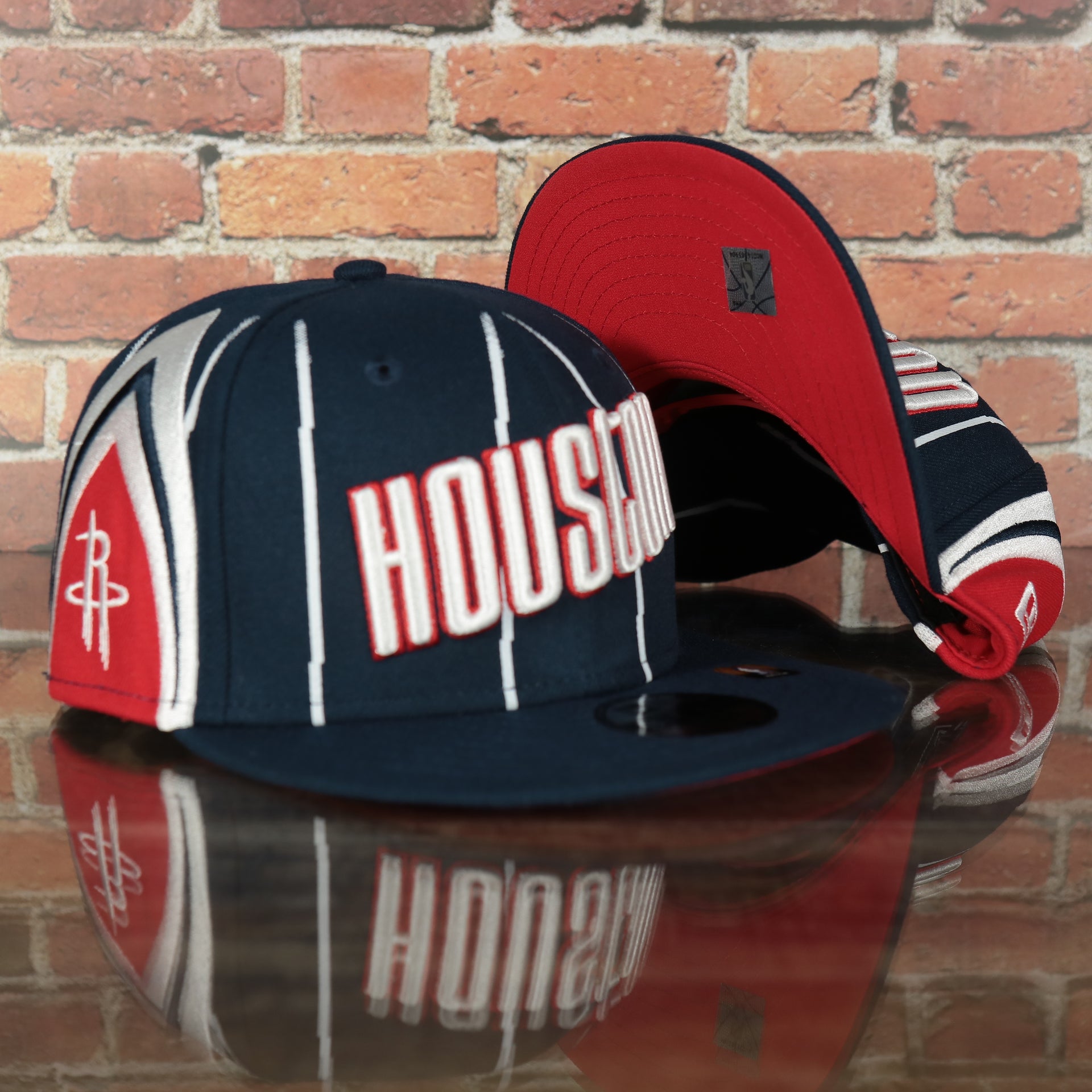 front and bottom of the Houston Rockets 2022 City Edition Retro Houston Red Bottom Youth 9Fifty Side Patch Snapback Cap | New Era, Navy