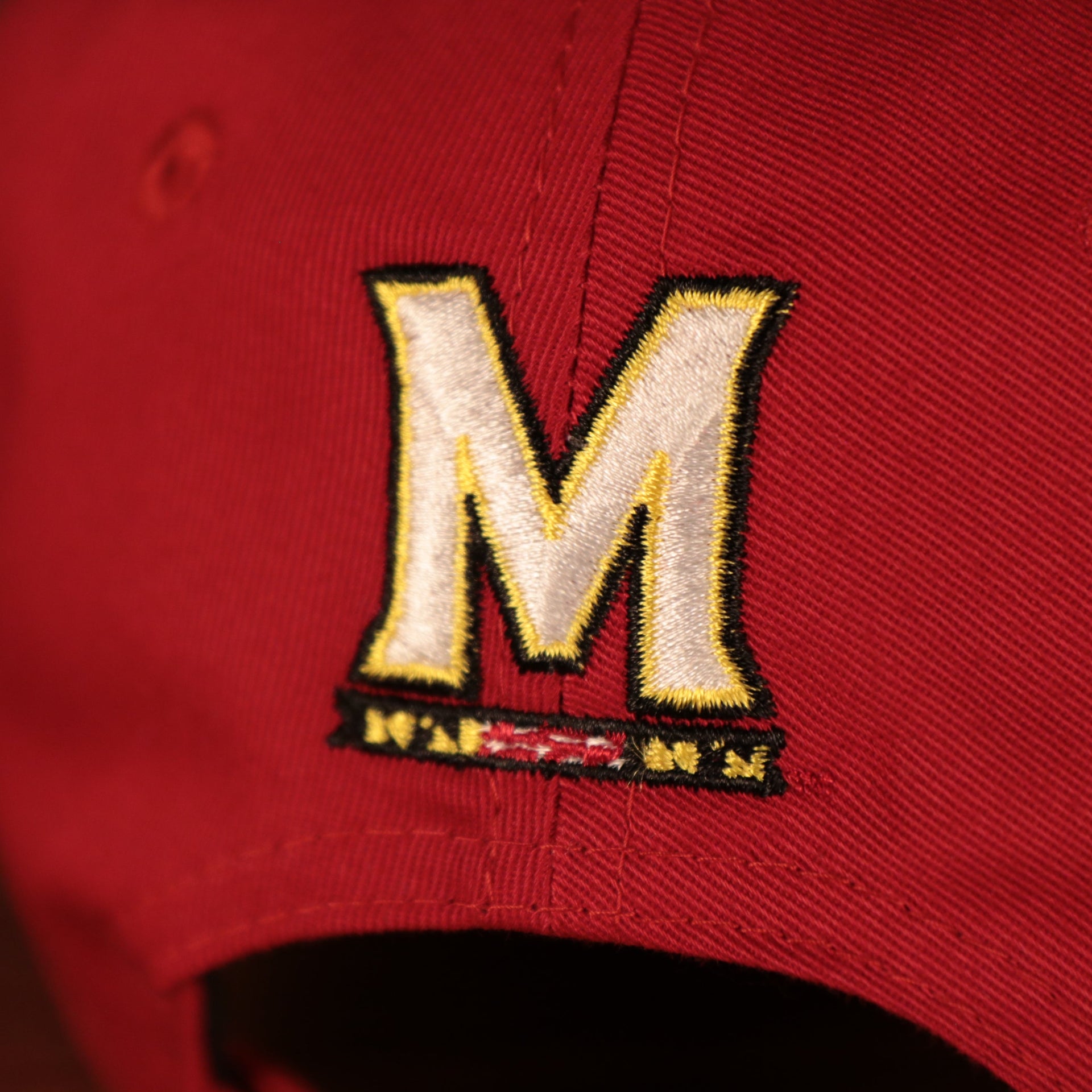Close up of the M logo on the back of the University of Maryland Terrapins The League 940 9Forty Adjustable Dad Hat