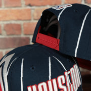 backside of the Houston Rockets 2022 City Edition Retro Houston Red Bottom Youth 9Fifty Side Patch Snapback Cap | New Era, Navy