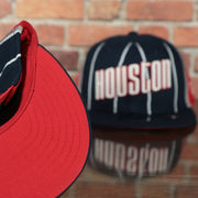 red underside of the Houston Rockets 2022 City Edition Retro Houston Red Bottom Youth 9Fifty Side Patch Snapback Cap | New Era, Navy