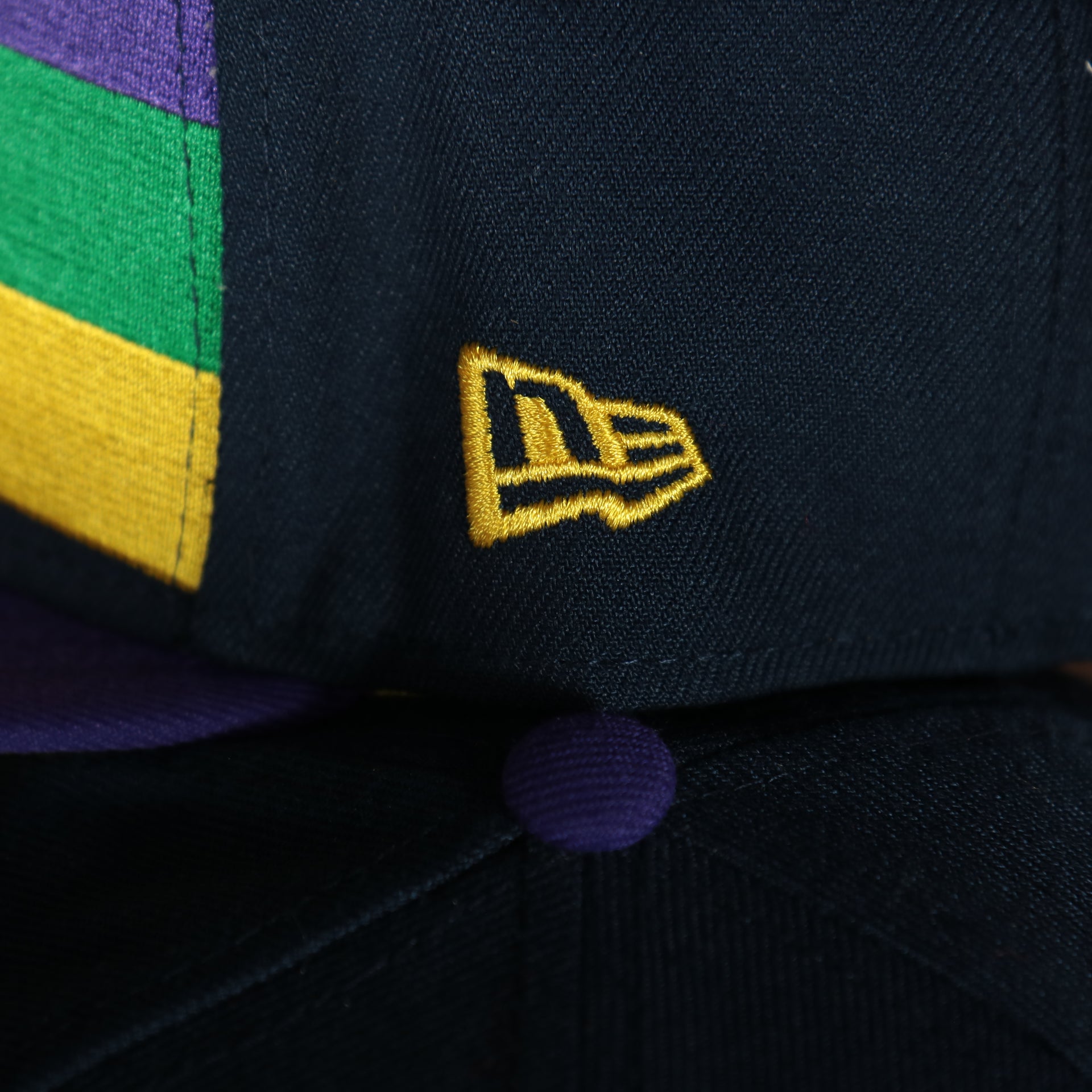 new logo on the wearers right side of the New Orleans Pelicans 2022 City Edition NOLA Logo Yellow Bottom Youth 9Fifty Side Patch Snapback Cap | New Era, Navy