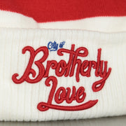 city of brotherly logo on the front cuff of the Philadelphia 76ers 2022 City Edition City Of Brotherly Love Youth Beanie | New Era, White