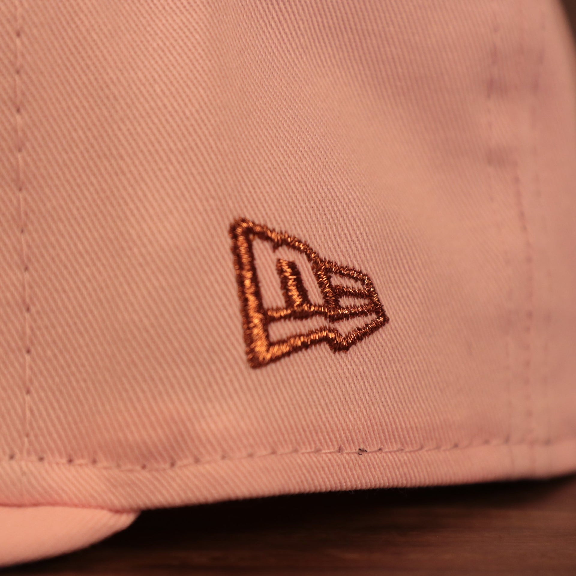 Close up of the new era logo on the Philadelphia Phillies Glow In The Dark 1996 All Star Game "il napoletano" Sky Blue Bottom Side Patch 59Fifty Fitted Cap