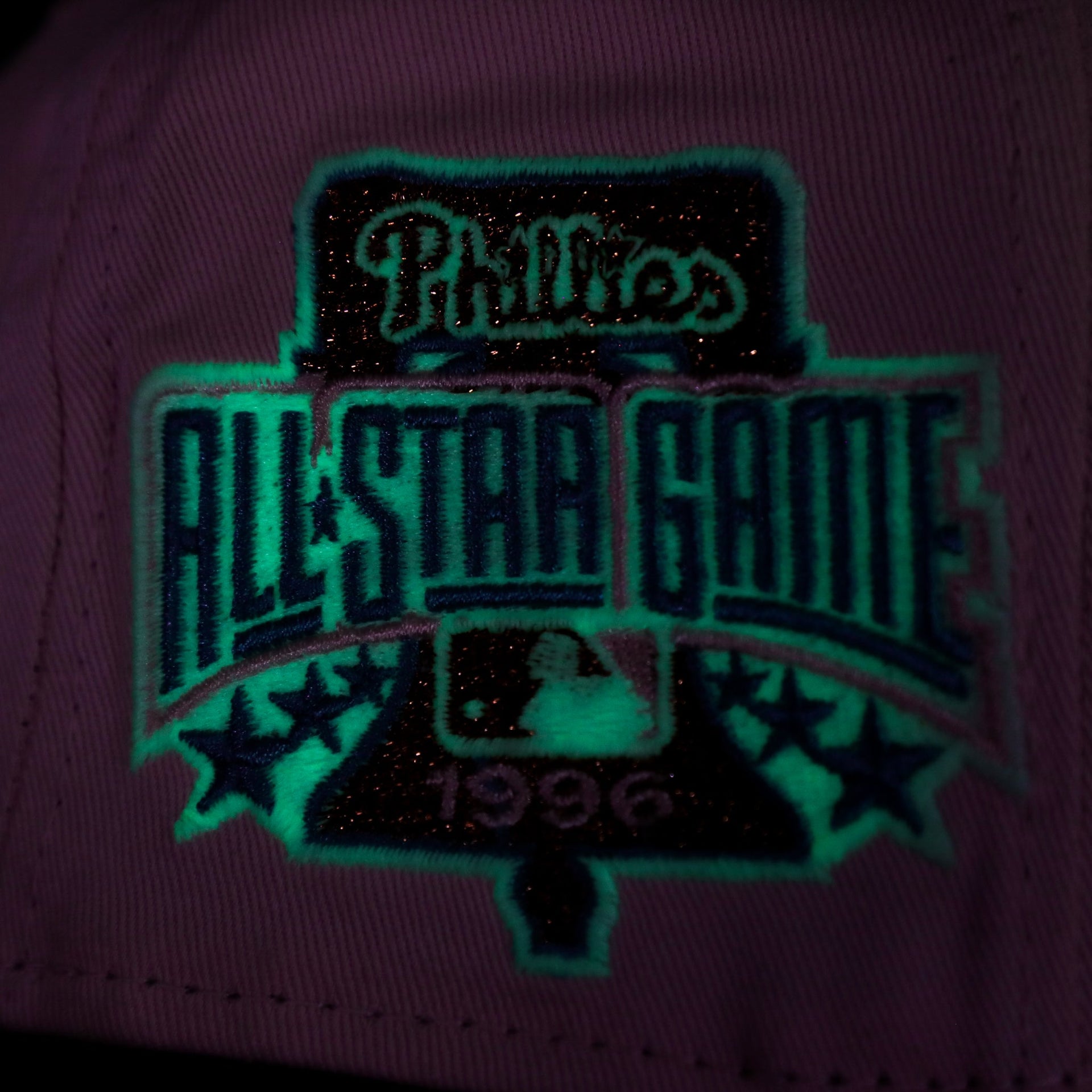 Close up of the glow in the dark sidepatch on the Philadelphia Phillies Glow In The Dark 1996 All Star Game "il napoletano" Sky Blue Bottom Side Patch 59Fifty Fitted Cap
