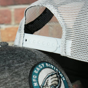 Close up of the adjustable snap on the back of the Philadelphia Eagles 2022 NFC East Division Champions Locker Room Official On Field 9Forty Mesh Trucker Hat