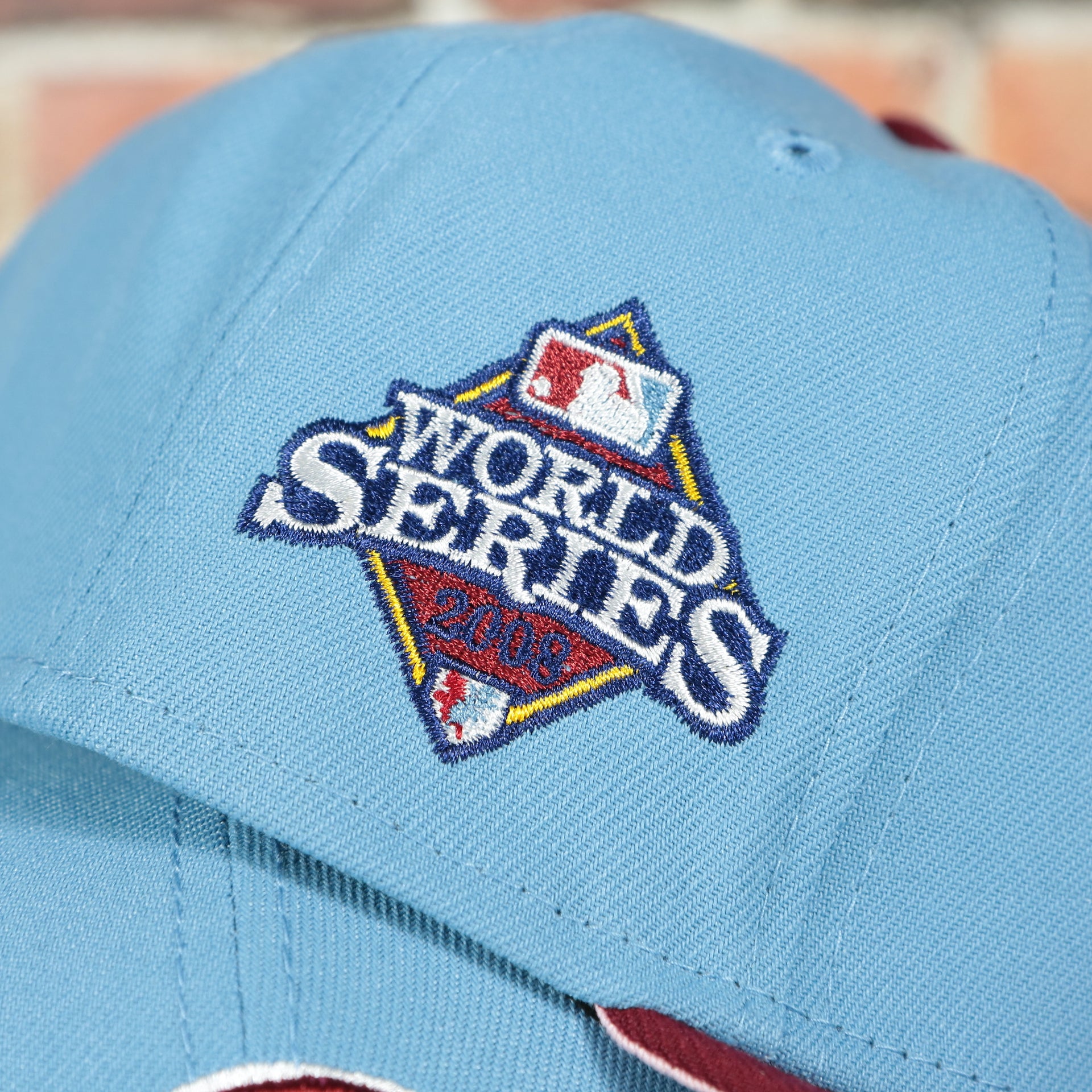 Close up on the 2008 World Series side patch on the Philadelphia Phillies 2008 World Series Side Patch Cooperstown Pink Bottom 59Fifty Fitted Cap | Sky Blue