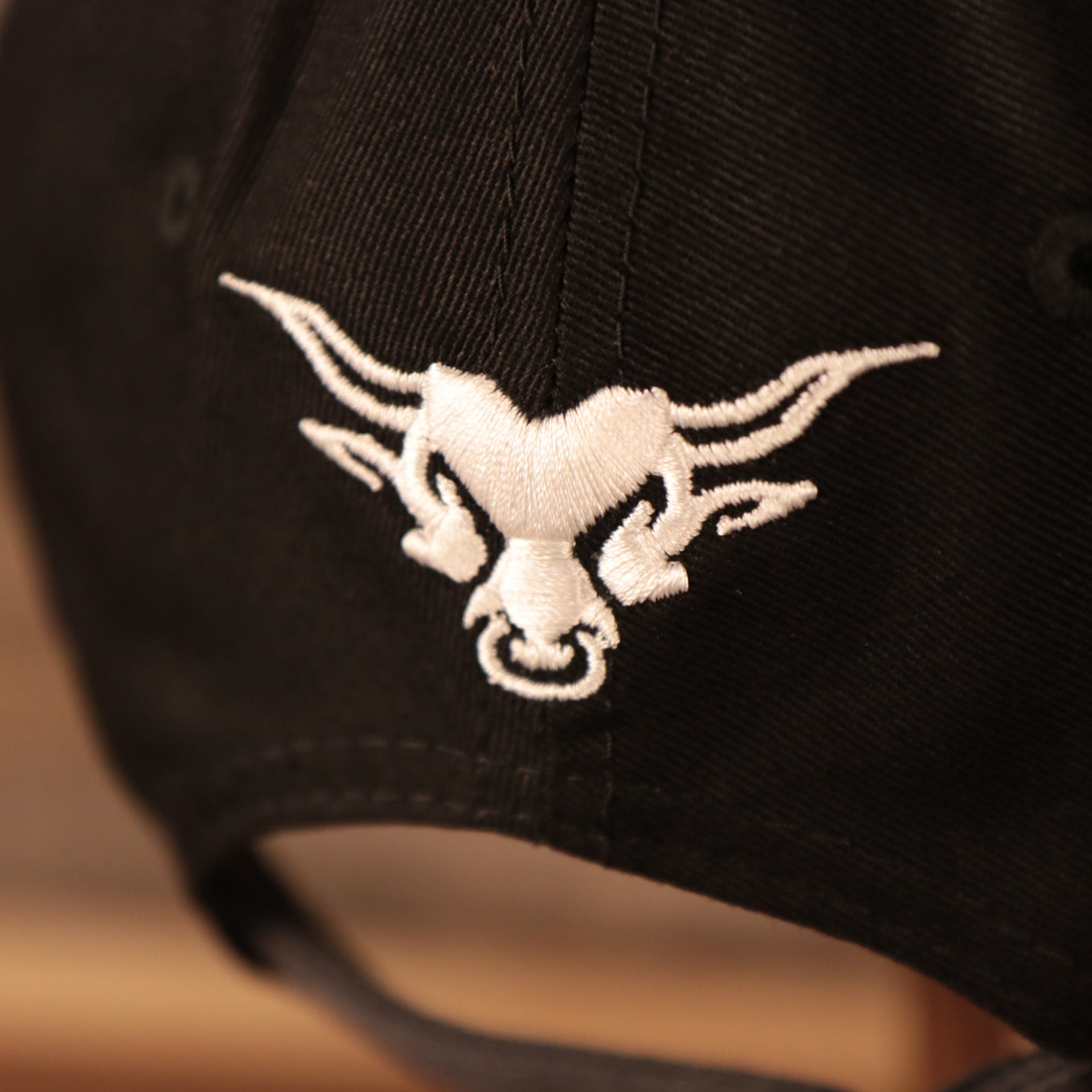 Close up of The Rock bull logo on the back of the Dwayne "The Rock" Johnson Vintage WWE 9Twenty Dad Hat