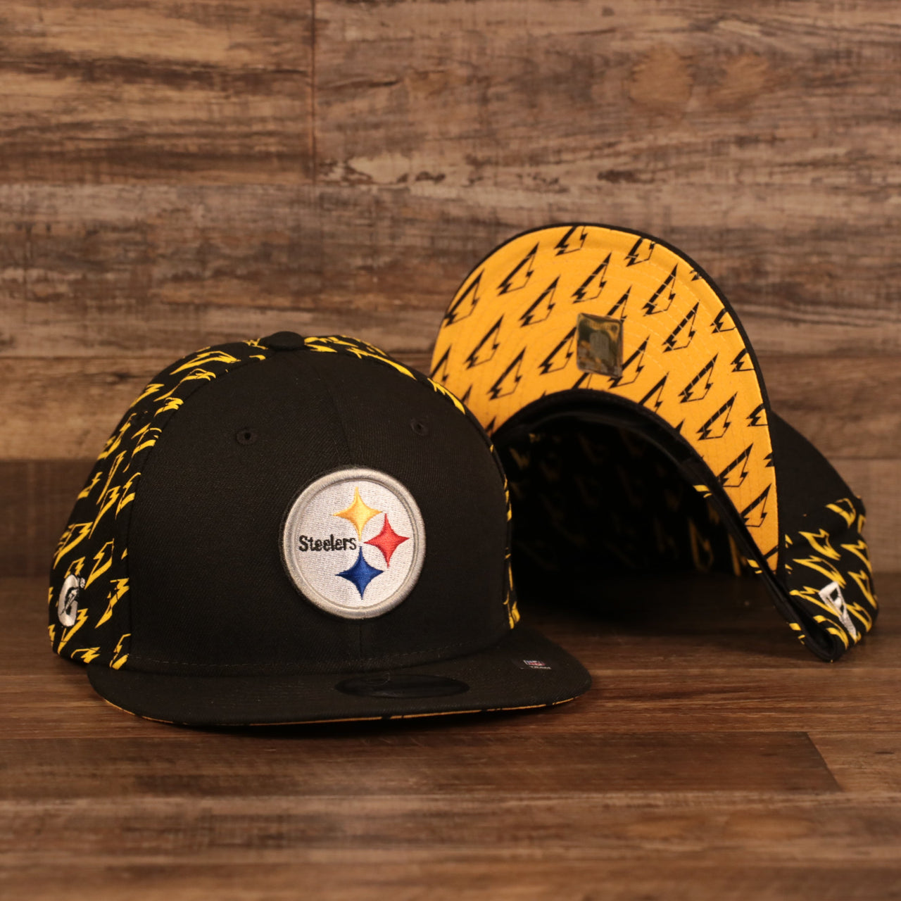 front and bottom of the Pittsburgh Steelers x Gatorade Black 9Fifty Yellow Bottom Snapback