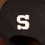 Close up of the S logo on the back of the Penn State Nittany Lions The League 940 9Forty Adjustable Dad Hat