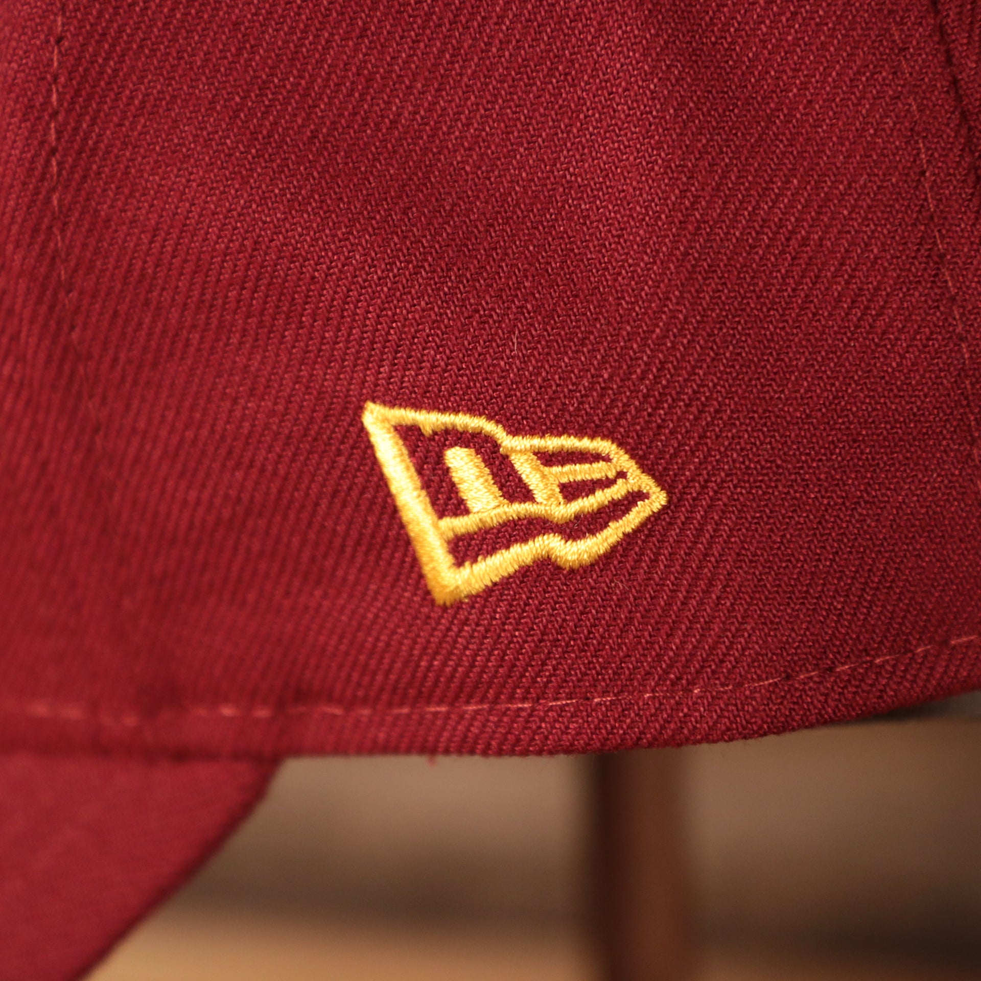 Close up of the New Era logo on the Temple Owls The League 940 9Forty Adjustable Dad Hat