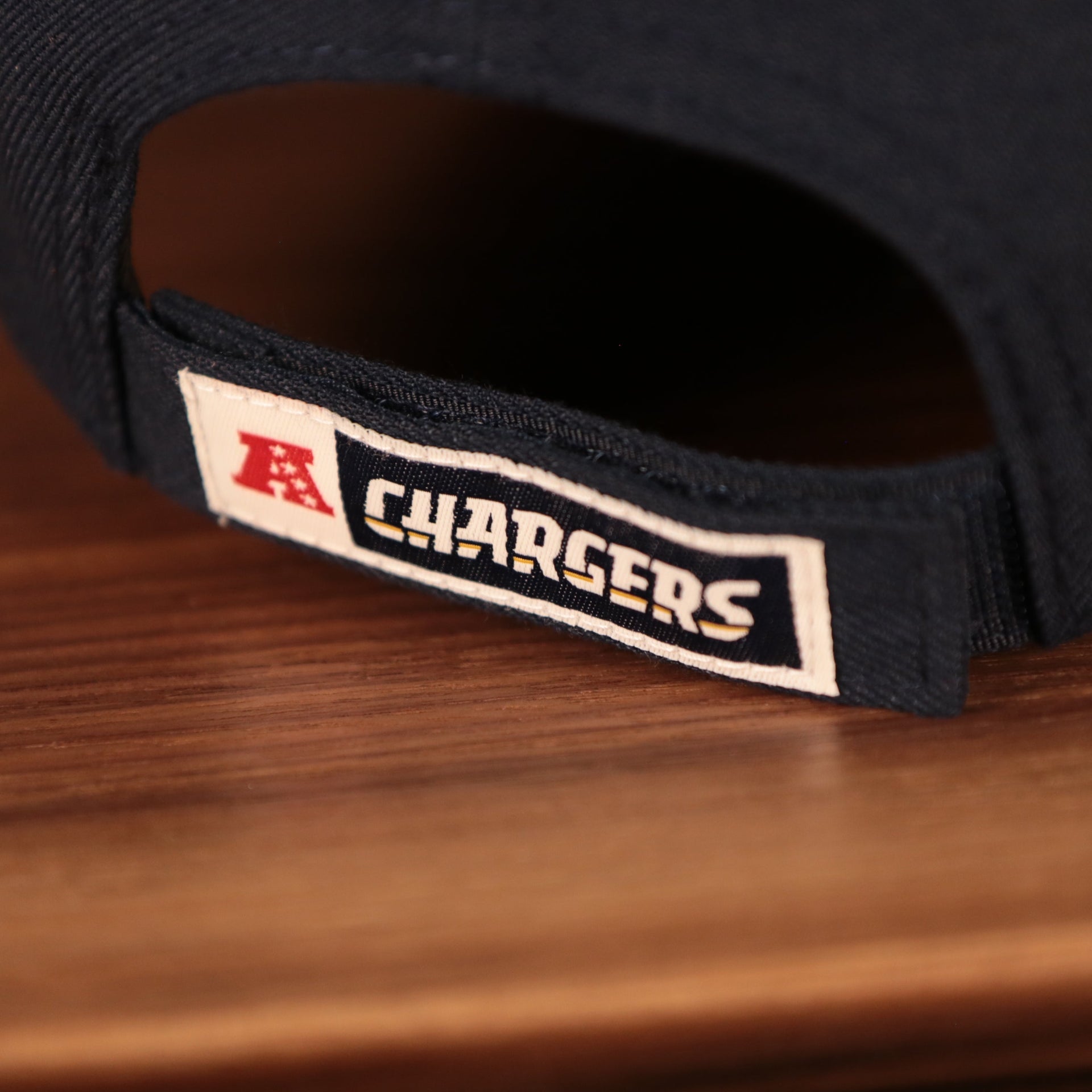 Close up of the adjustable strap on the back of the Los Angeles Chargers The League 940 9Forty Adjustable Dad Hat