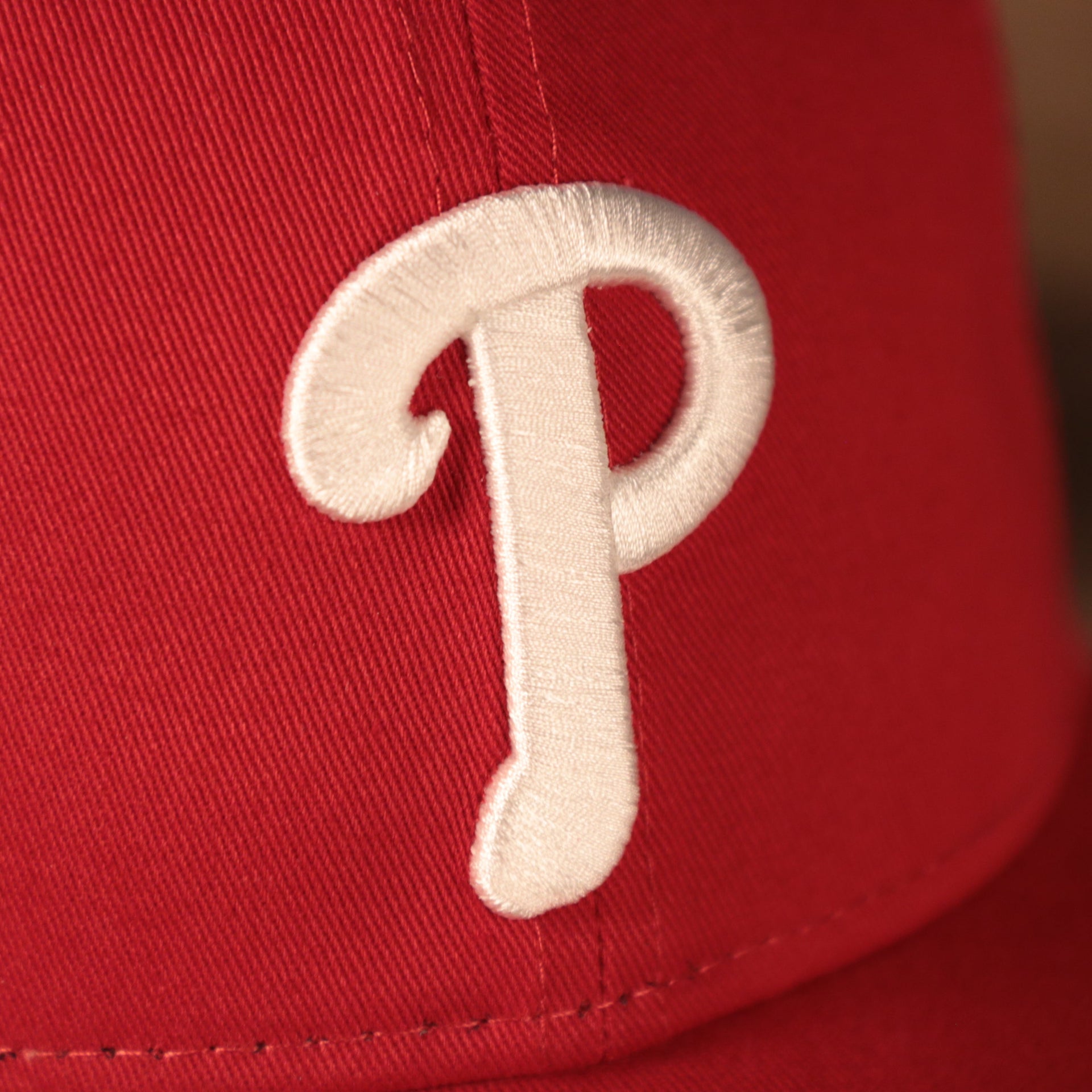Close up of the Philadelphia Phillies logo on the Philadelphia Phillies Mesh Back 940 9Forty Trucker Dad Hat