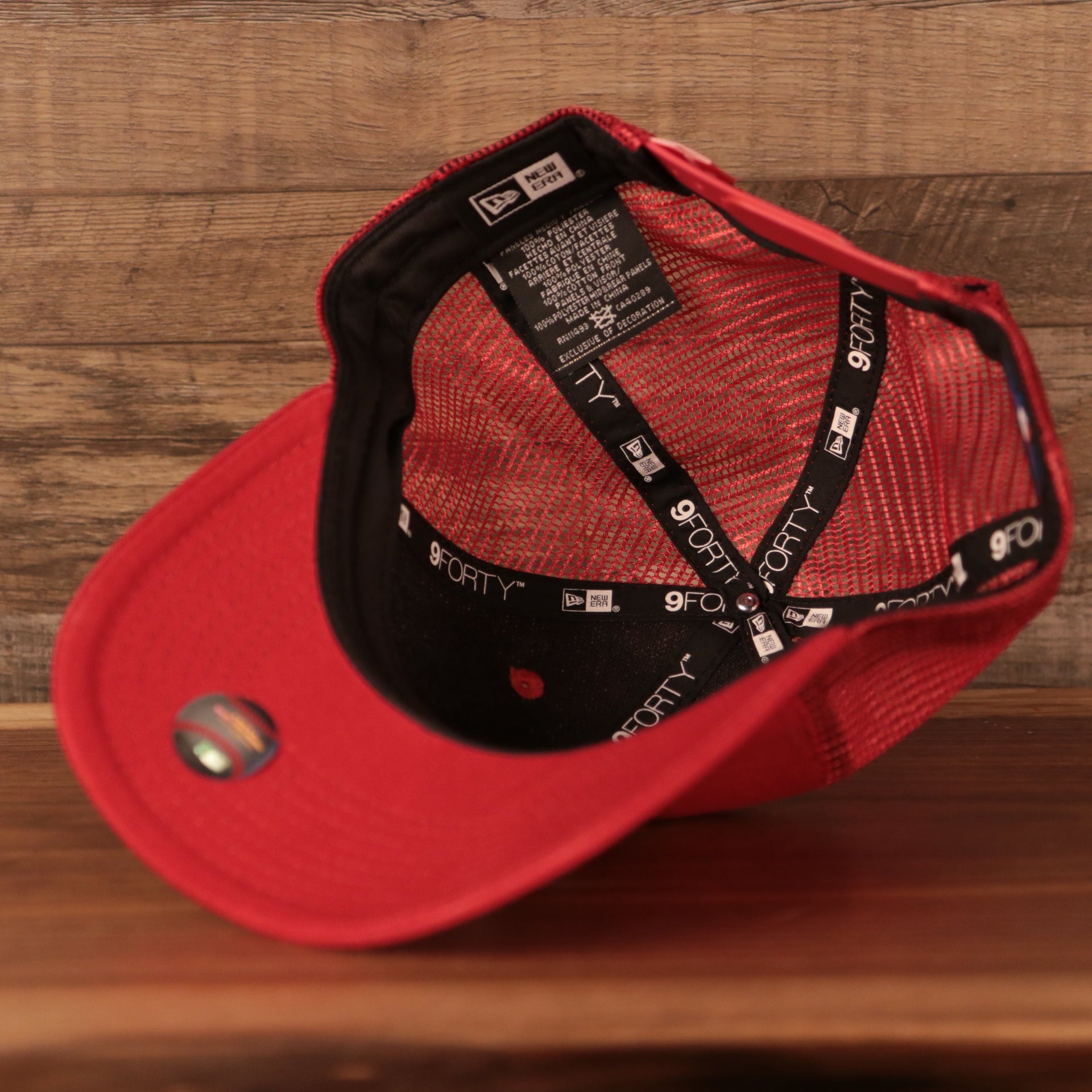 Red under visor of the Philadelphia Phillies Mesh Back 940 9Forty Trucker Dad Hat