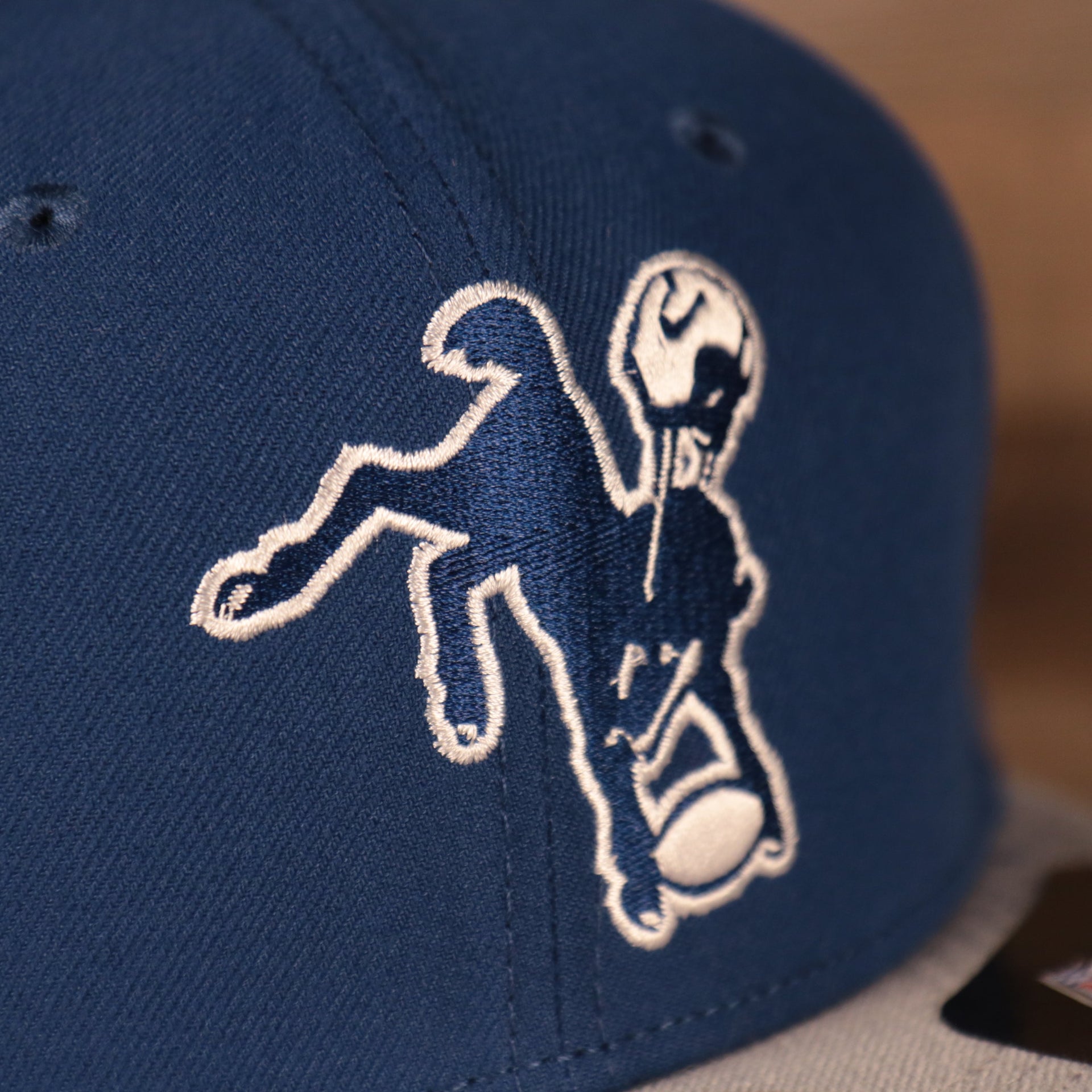 Close up of the baltimore colts logo on the front of the Baltimore Colts 1961-1978 Throwback Logo Vintage NFL 9Fifty Snapback Hat