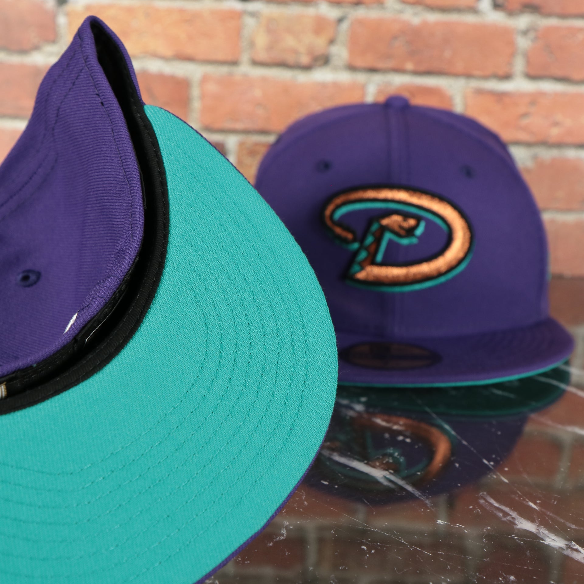 teal under visor on the 2001 World Series Arizona Diamondbacks Cooperstown Grape 5 Side Patch Fitted | Purple 59Fifty Teal Bottom Fitted Cap