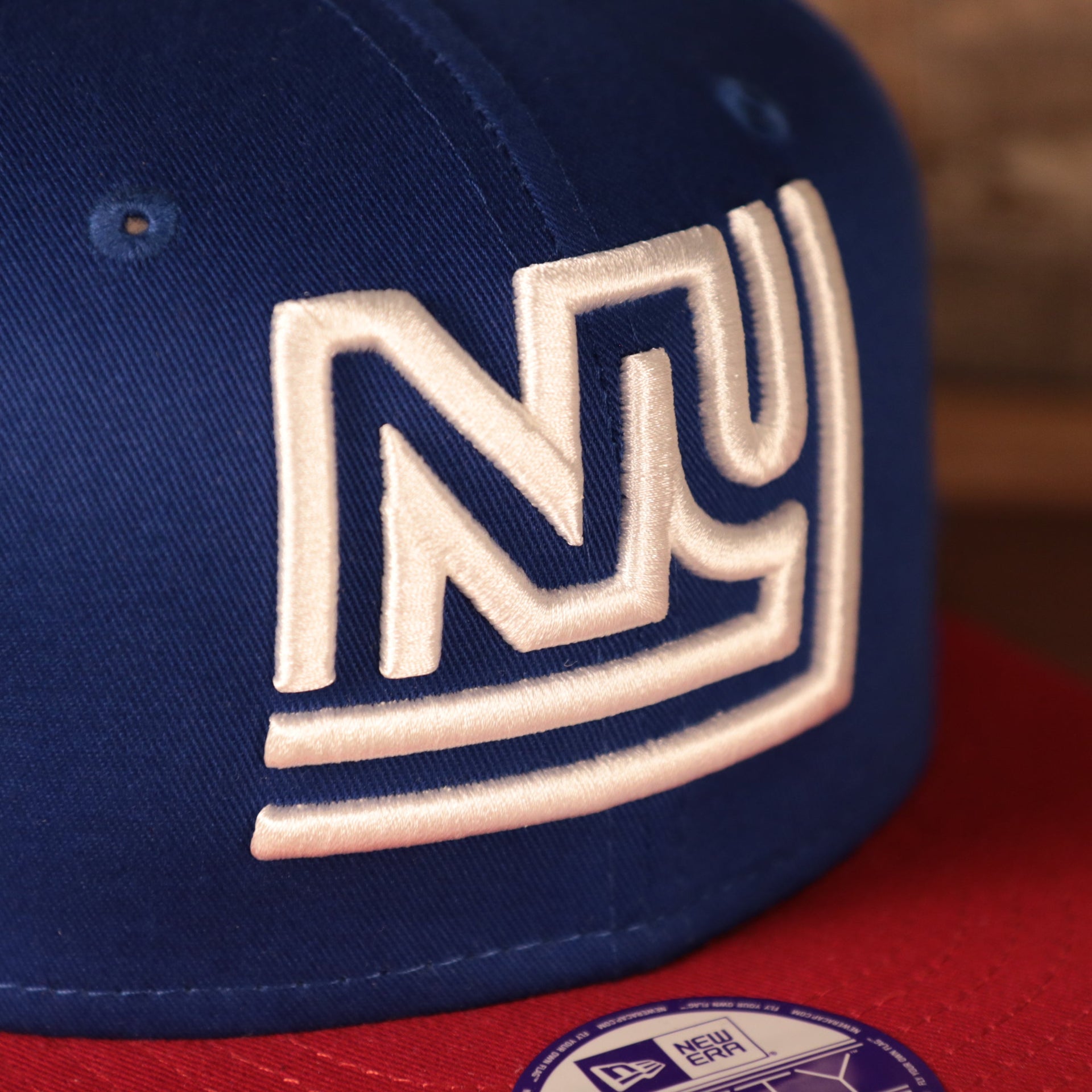 Close up of the New York Giants 1975 logo on the Kid's New York Giants 1975 Throwback Logo Vintage NFL 9Fifty Youth Snapback Hat