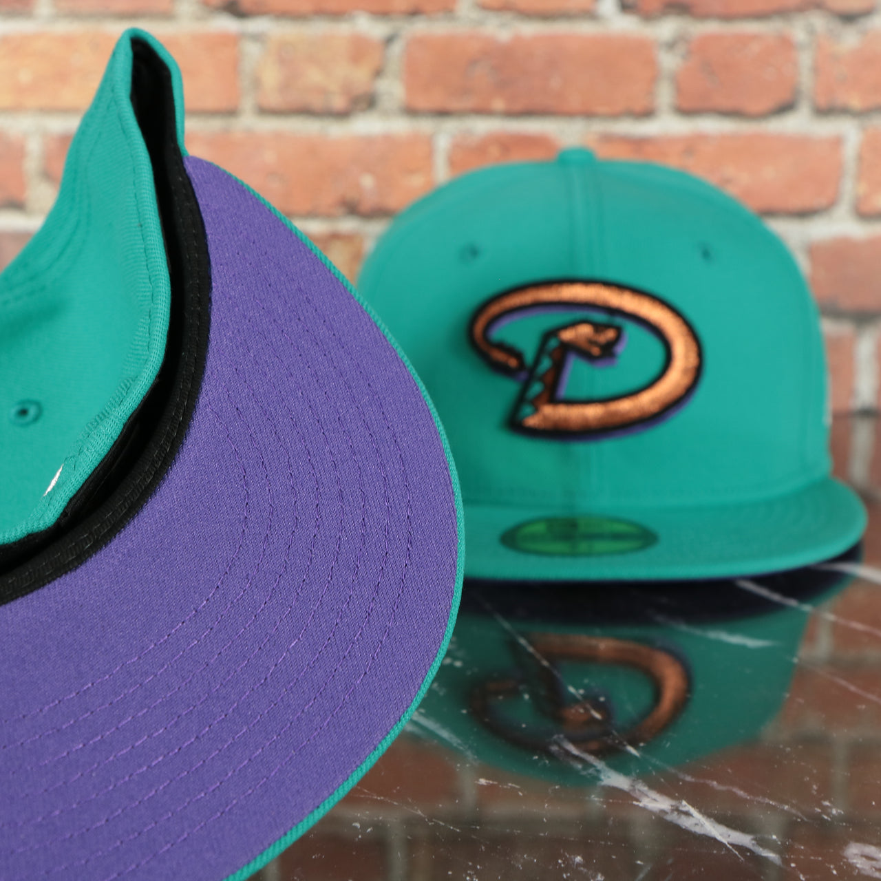 purple under visor on the Arizona Diamondbacks 2001 World Series Purple Bottom 59fifty Fitted Cap | Teal