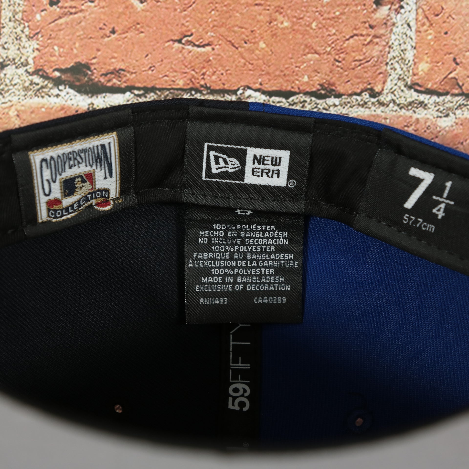 new era label on the New York Yankees x Mets Split Crown Grey Bottom 59fifty Side Patch Fitted | Navy/Royal Blue Yankees x Mets 5950 Cap