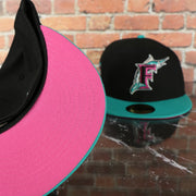 pink under visor on the Florida Marlins 2003 World Series 100th Anniversary Side Patch 59FIFTY Fitted Cap | Vice Blue Pack