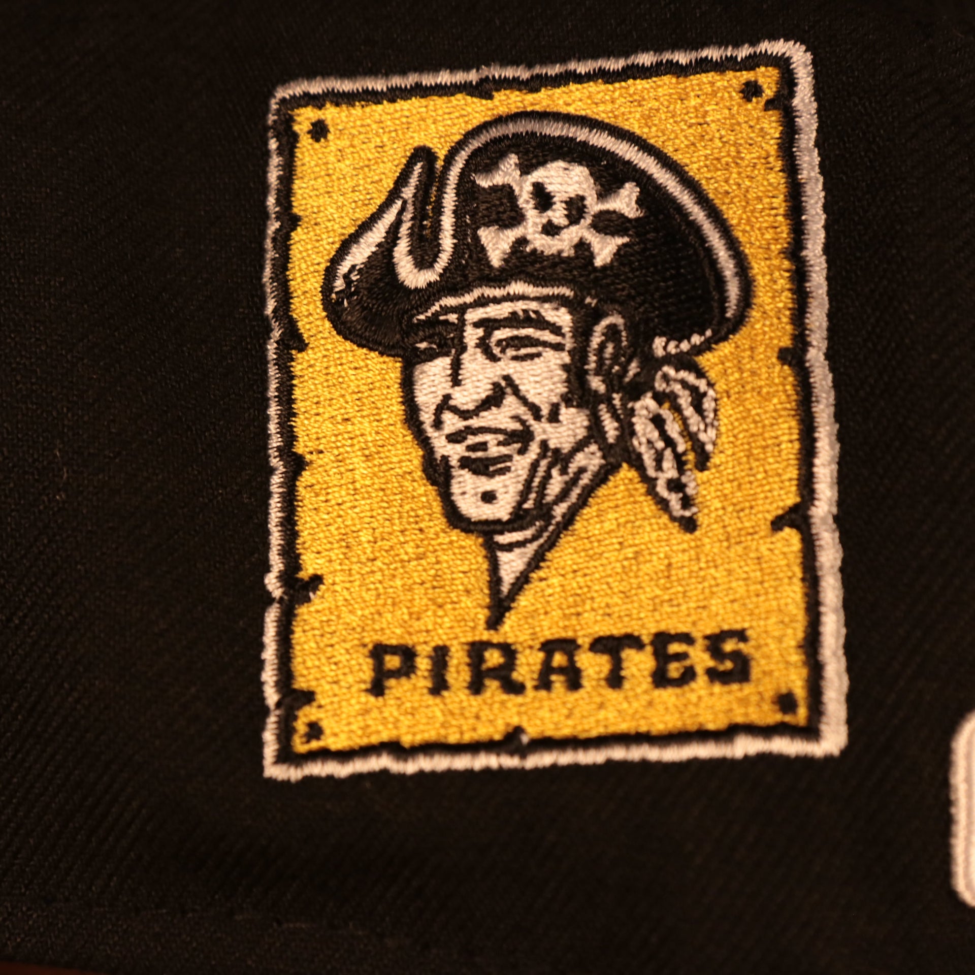 Close up of the 1970 Pittsburgh Pirates logo on the Pittsburgh Pirates "Patch Pride" All Over Gray Bottom Side Patch 59Fifty Fitted Cap