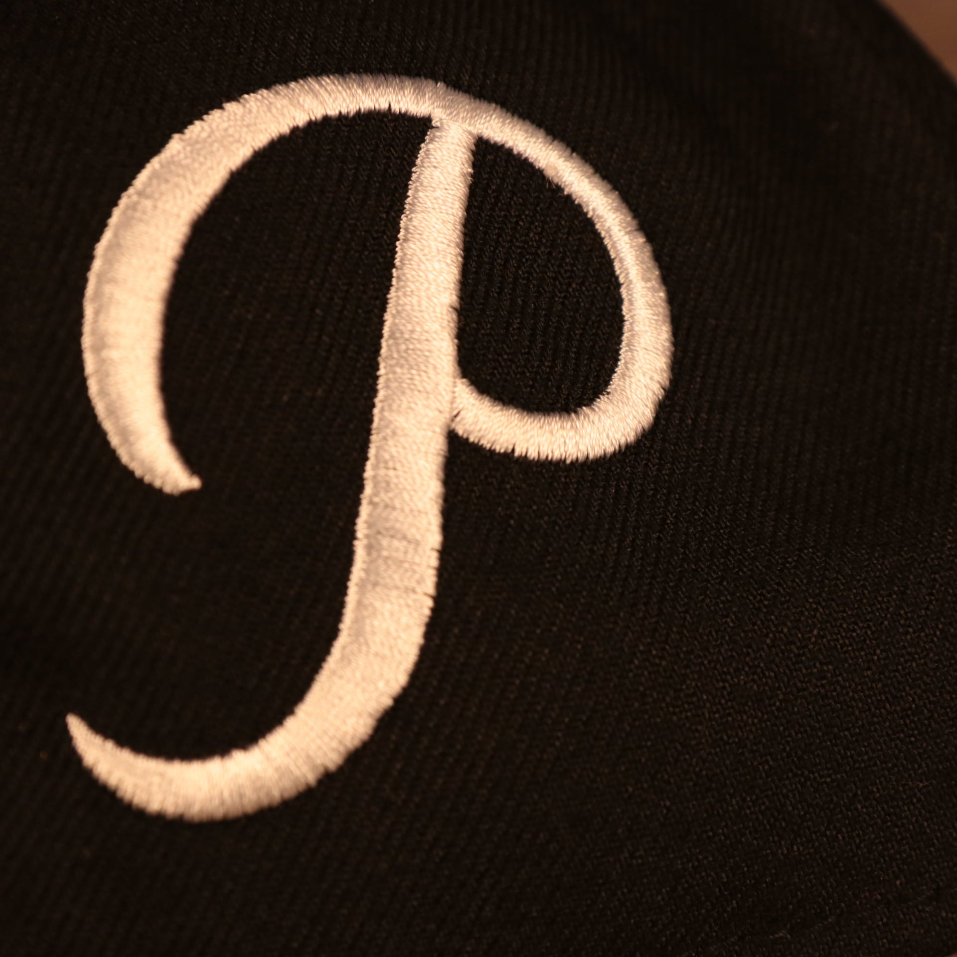 Close up of alternate Pirates logo on the Pittsburgh Pirates "Patch Pride" All Over Gray Bottom Side Patch 59Fifty Fitted Cap