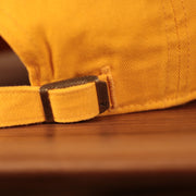 adjustable strap on the back of the Minnesota North Stars Yellow Adjustable Retro Dad Hat