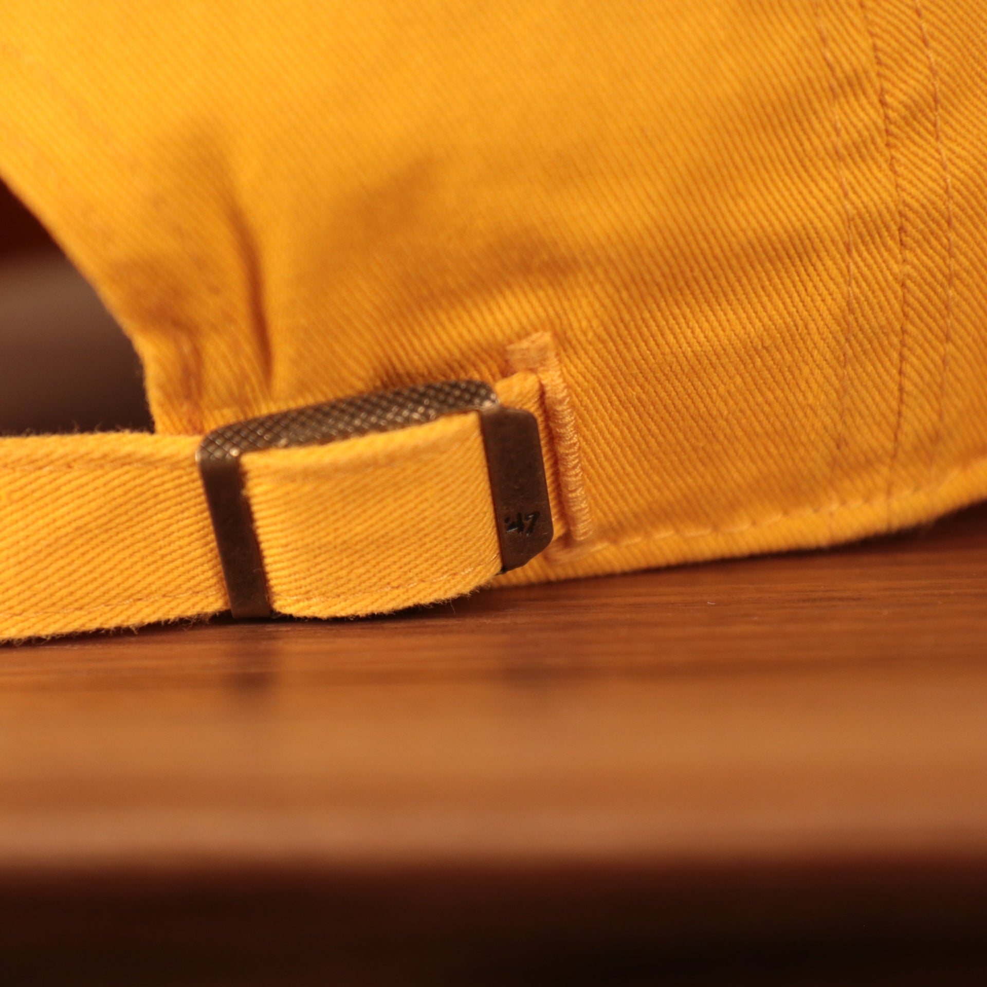 adjustable strap on the back of the Minnesota North Stars Yellow Adjustable Retro Dad Hat