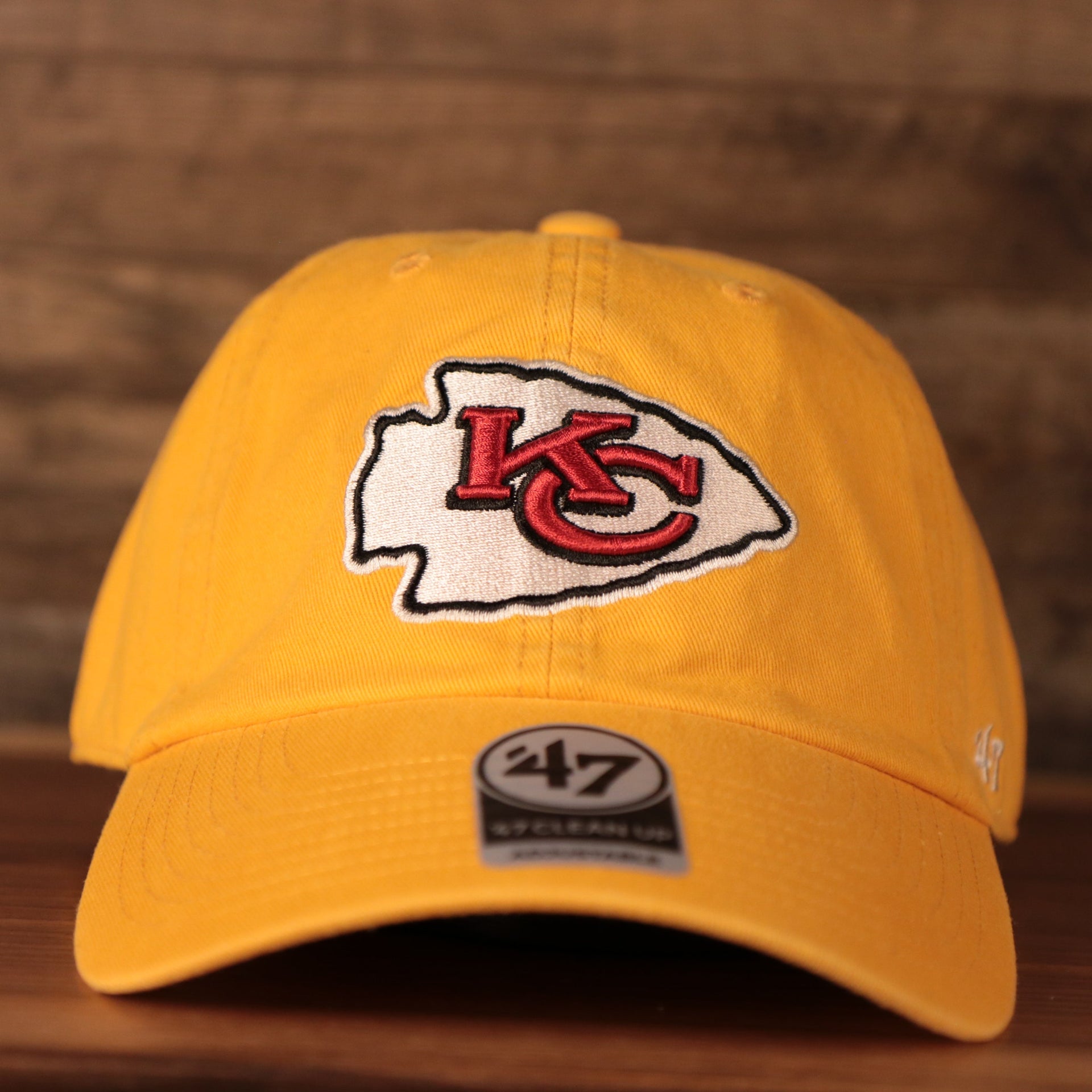 front of the Kansas City Chiefs Yellow Adjustable Dad Hat